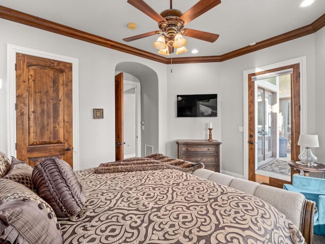 bedroom featuring ceiling fan, ornamental molding, and ensuite bathroom