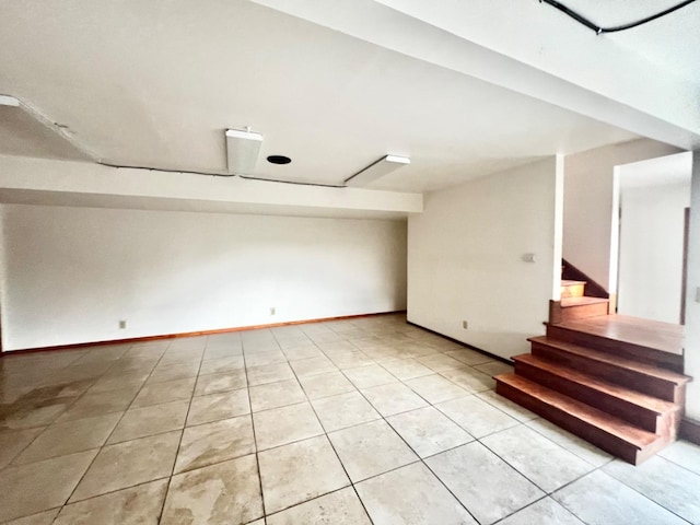 basement with light tile patterned flooring