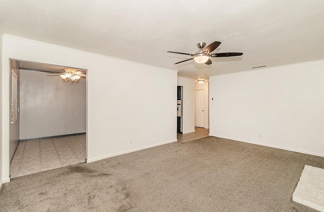 unfurnished room with carpet, ceiling fan, and ornamental molding