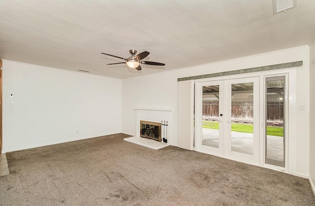 unfurnished living room with ceiling fan, carpet flooring, french doors, and a textured ceiling