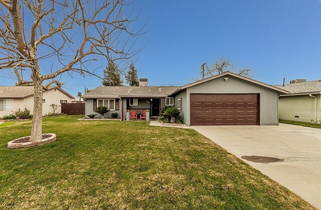 single story home with a garage and a front lawn