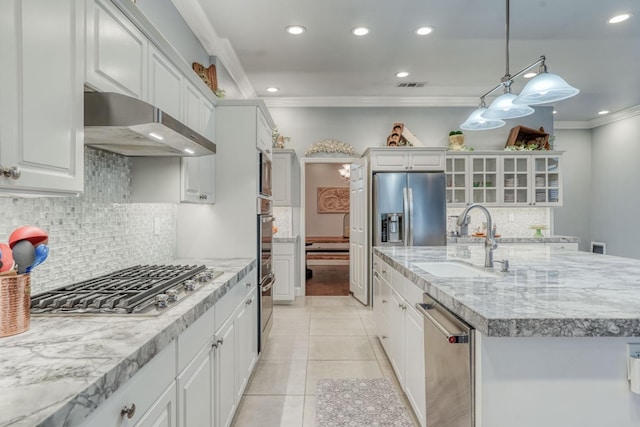 kitchen with white cabinetry, sink, tasteful backsplash, decorative light fixtures, and appliances with stainless steel finishes