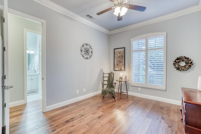 living area featuring ceiling fan, light hardwood / wood-style floors, and ornamental molding