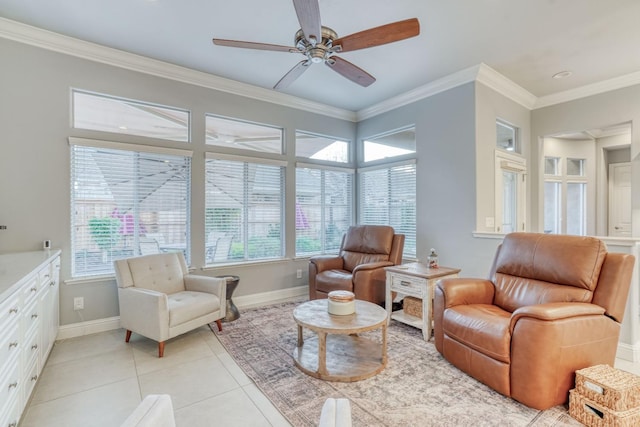 living area with ceiling fan, light tile patterned floors, and crown molding