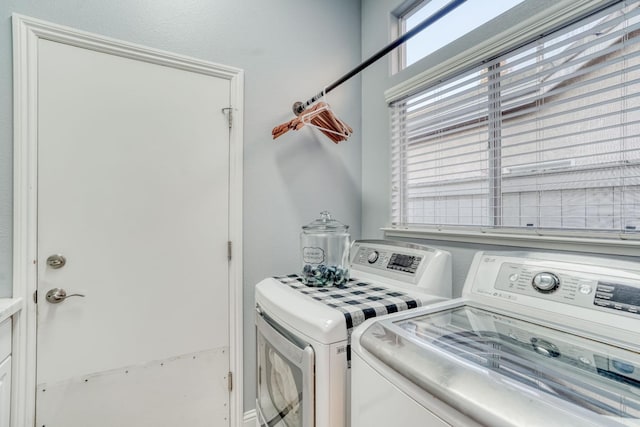 laundry room featuring washing machine and clothes dryer