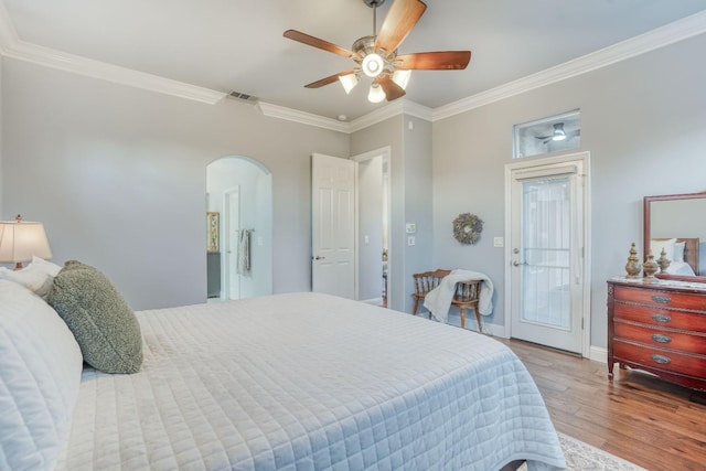 bedroom with ceiling fan, light wood-type flooring, and ornamental molding