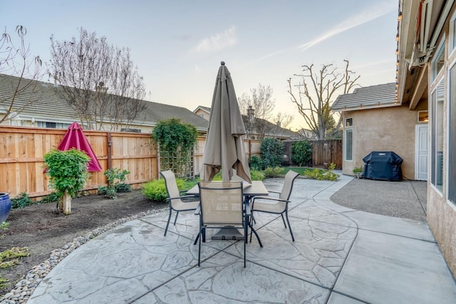 patio terrace at dusk with grilling area