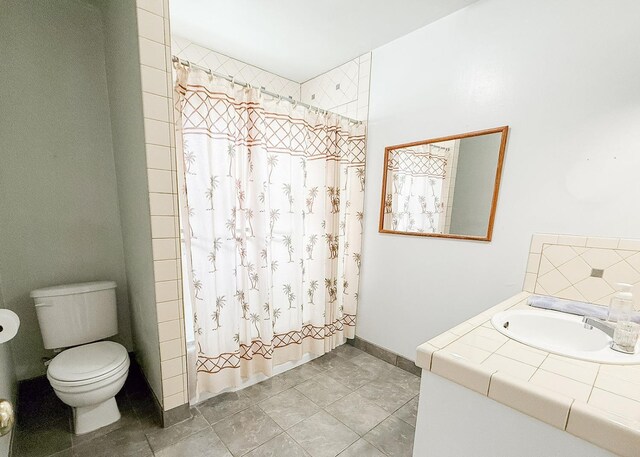 full bathroom with vanity, toilet, and shower / bath combo with shower curtain