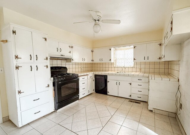 kitchen featuring black appliances, white cabinets, sink, and tasteful backsplash