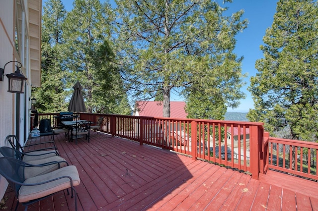 39722 Crest Point Ln, Shaver Lake, CA 93664 - wooden deck with outdoor dining space