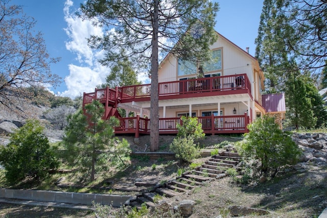 39722 Crest Point Ln, Shaver Lake, CA 93664 - rear view of house with stairway and a wooden deck