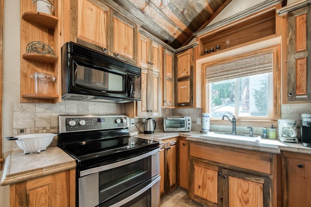 39722 Crest Point Ln, Shaver Lake, CA 93664 - kitchen with range with two ovens, black microwave, open shelves, a sink, and vaulted ceiling