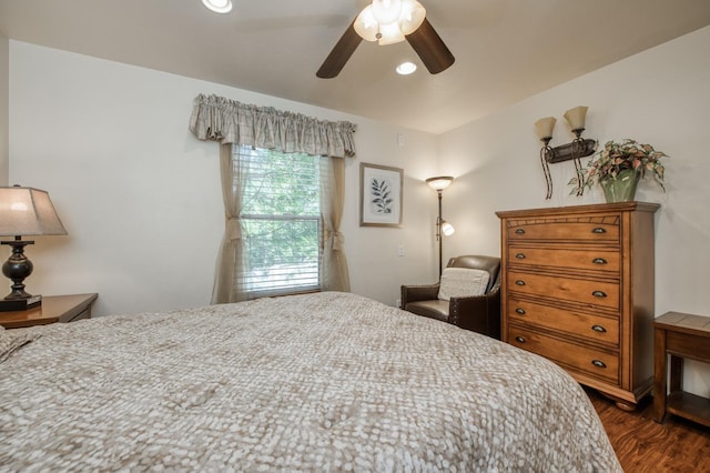 bedroom featuring ceiling fan and dark wood-type flooring