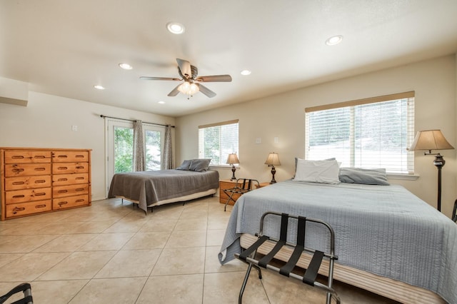 tiled bedroom featuring ceiling fan