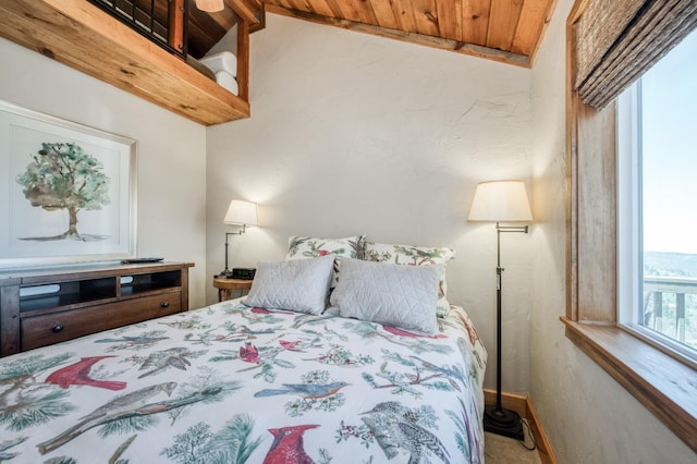 bedroom with wood ceiling and vaulted ceiling