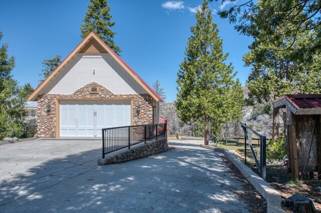 view of side of home with a garage