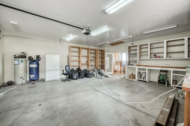 garage with white fridge, a garage door opener, and gas water heater