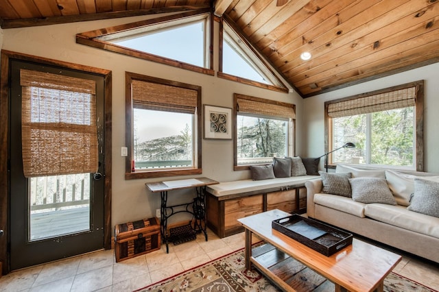 sunroom / solarium featuring vaulted ceiling and wood ceiling