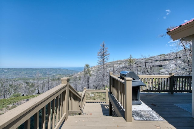 wooden terrace with a mountain view