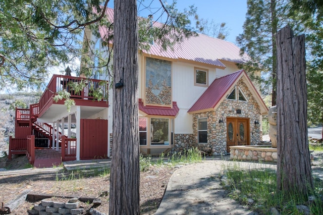 view of front of house featuring a wooden deck and french doors