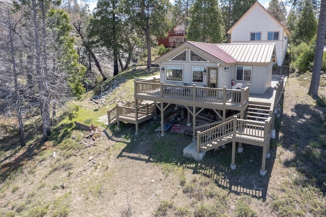 39722 Crest Point Ln, Shaver Lake, CA 93664 - rear view of property with stairs, a deck, and metal roof