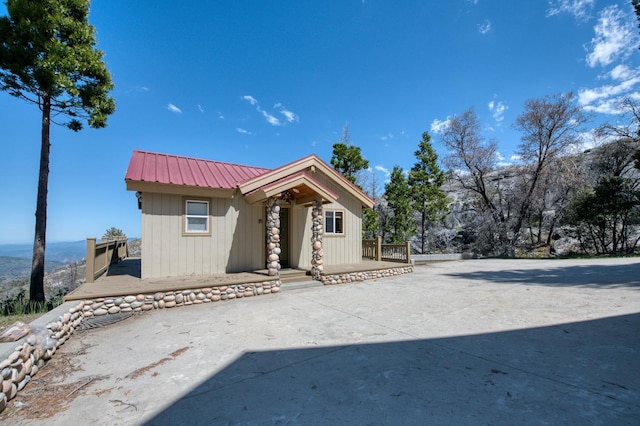 39722 Crest Point Ln, Shaver Lake, CA 93664 - view of front of property featuring metal roof and a porch