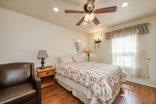 bedroom featuring ceiling fan and dark hardwood / wood-style floors