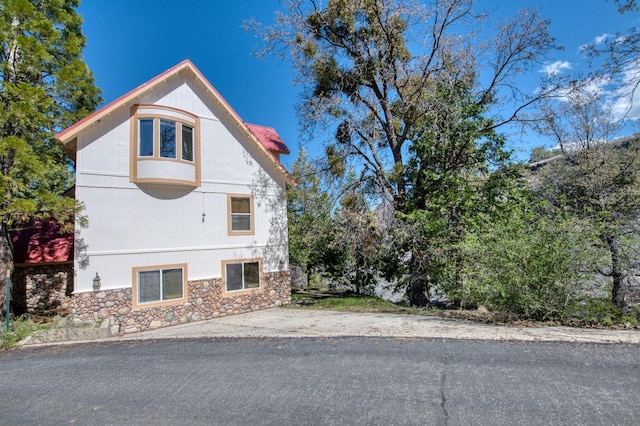 39722 Crest Point Ln, Shaver Lake, CA 93664 - view of home's exterior featuring stone siding