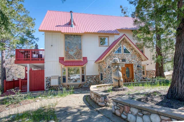 39722 Crest Point Ln, Shaver Lake, CA 93664 - view of front of house featuring stone siding and metal roof