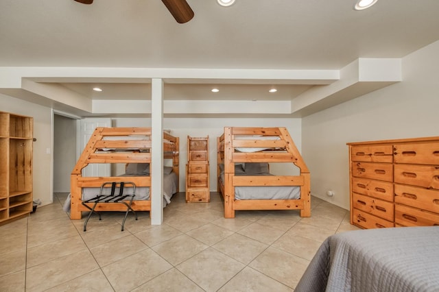 tiled bedroom with ceiling fan