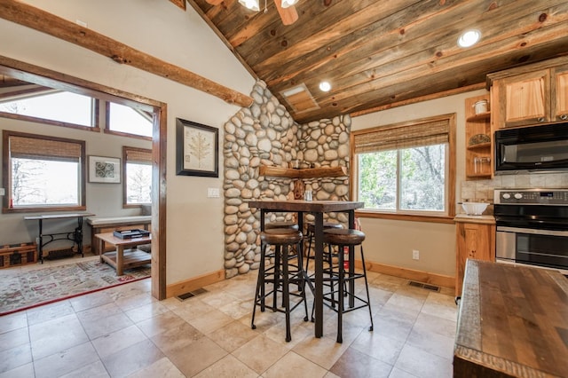 39722 Crest Point Ln, Shaver Lake, CA 93664 - dining space featuring baseboards, wood ceiling, healthy amount of natural light, and light tile patterned floors