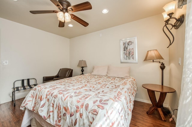 bedroom with ceiling fan and dark hardwood / wood-style floors