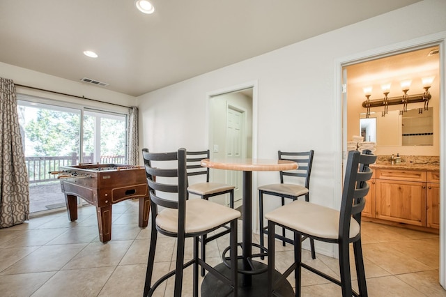 39722 Crest Point Ln, Shaver Lake, CA 93664 - dining room featuring light tile patterned floors and recessed lighting