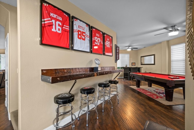 game room with bar area, ceiling fan, dark wood-type flooring, and pool table