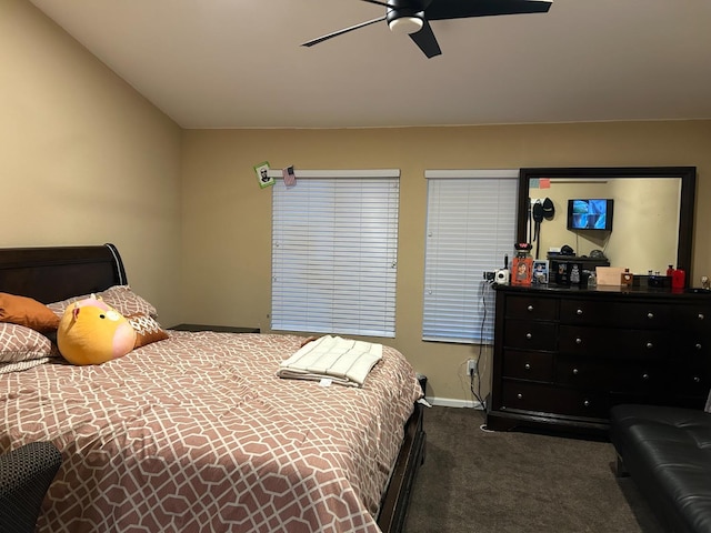 carpeted bedroom with vaulted ceiling and ceiling fan