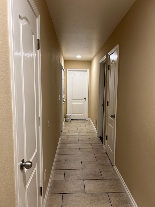 hall with light wood-type flooring