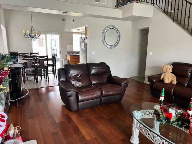 living room featuring dark hardwood / wood-style floors and a notable chandelier