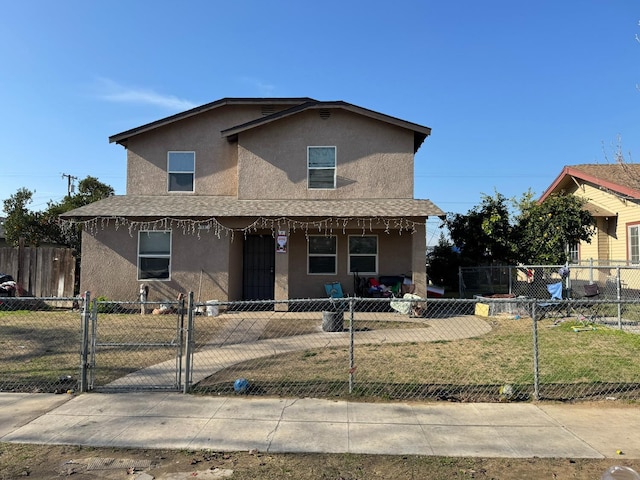 view of front of home featuring covered porch and a front lawn