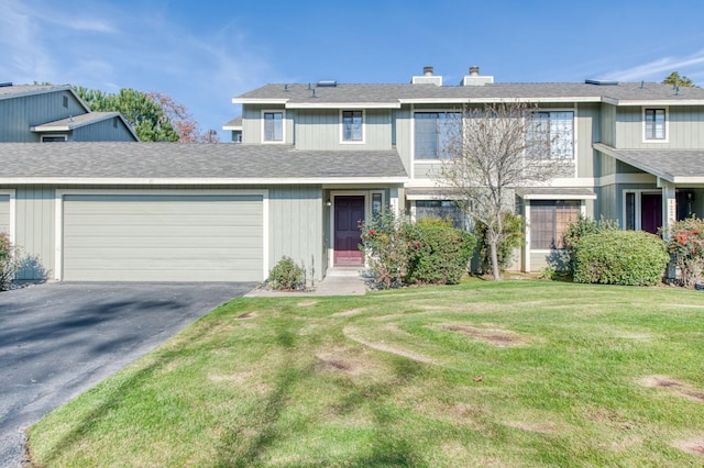 view of front facade featuring a garage and a front lawn