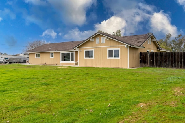 back of house featuring a yard