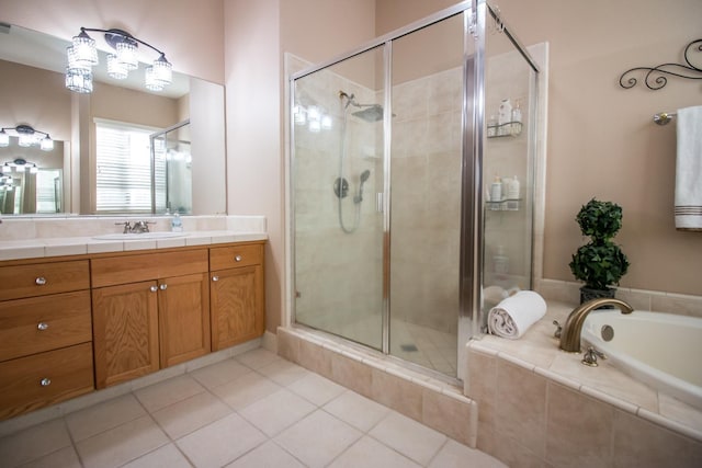 bathroom featuring tile patterned floors, vanity, and independent shower and bath