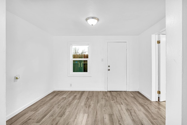 spare room featuring light wood-type flooring