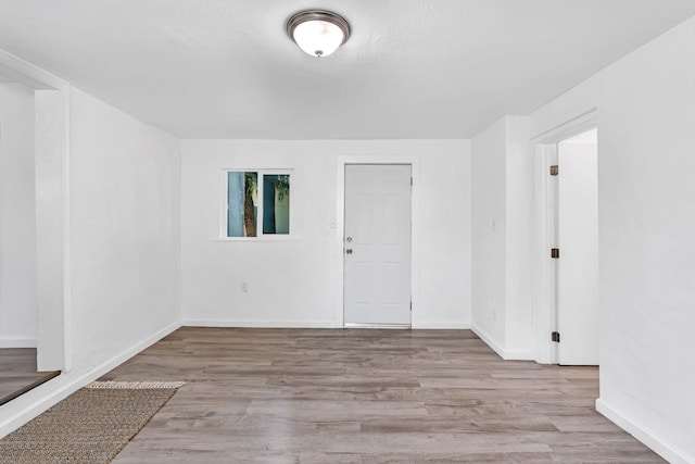 spare room featuring light hardwood / wood-style flooring