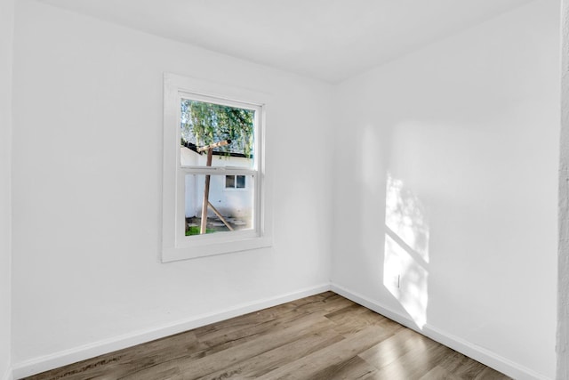 unfurnished room with light wood-type flooring