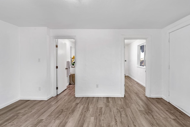 spare room featuring light hardwood / wood-style floors