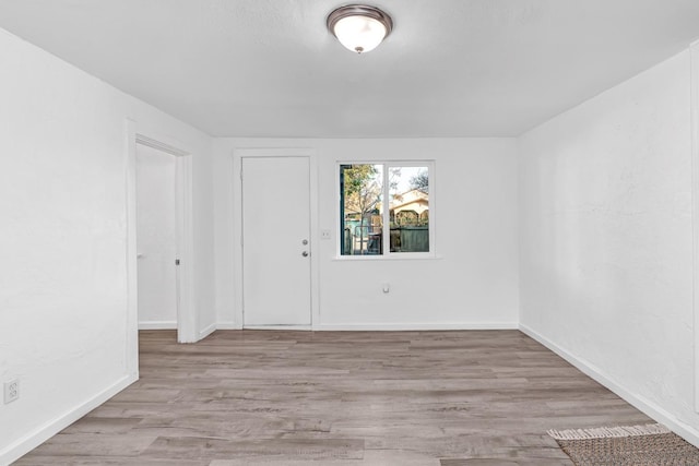 unfurnished room with light hardwood / wood-style floors