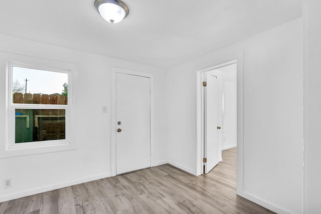 spare room with light hardwood / wood-style flooring