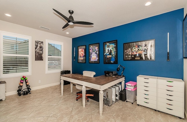 tiled office space with ceiling fan