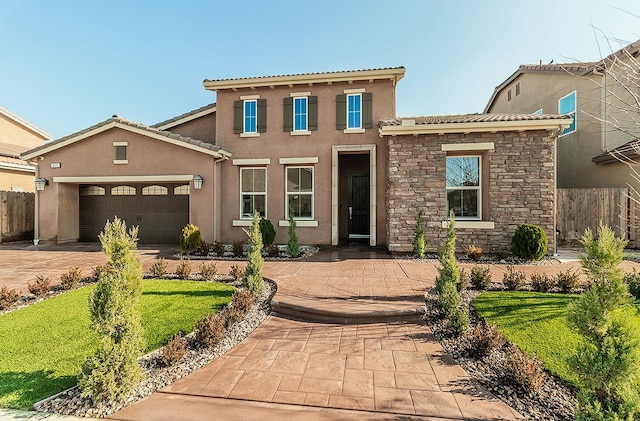 view of front of home featuring a garage and a front lawn