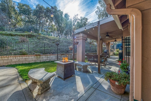 view of patio / terrace featuring a fire pit and ceiling fan